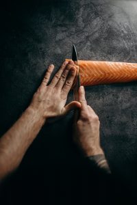 chef cutting fish